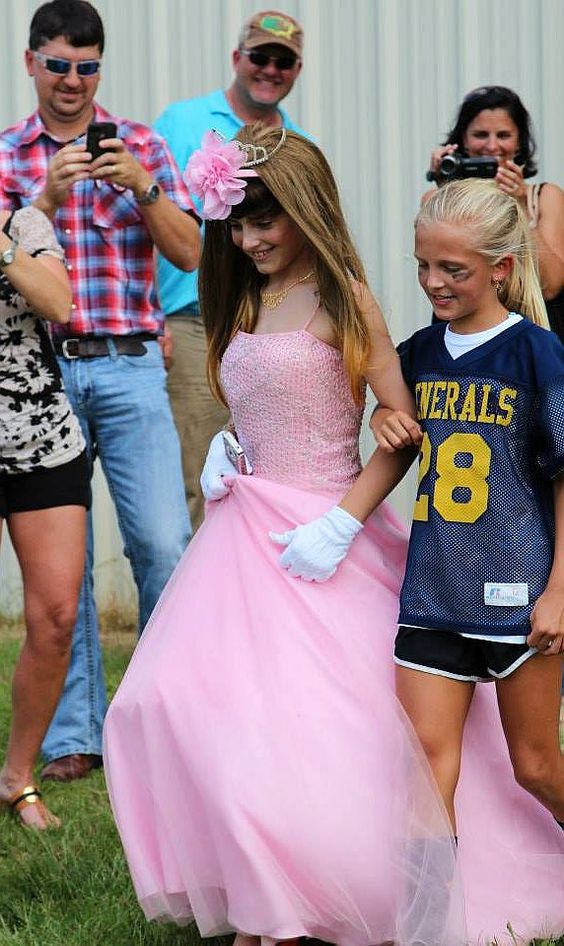 Boy dressed as girls in womanless beauty pageant