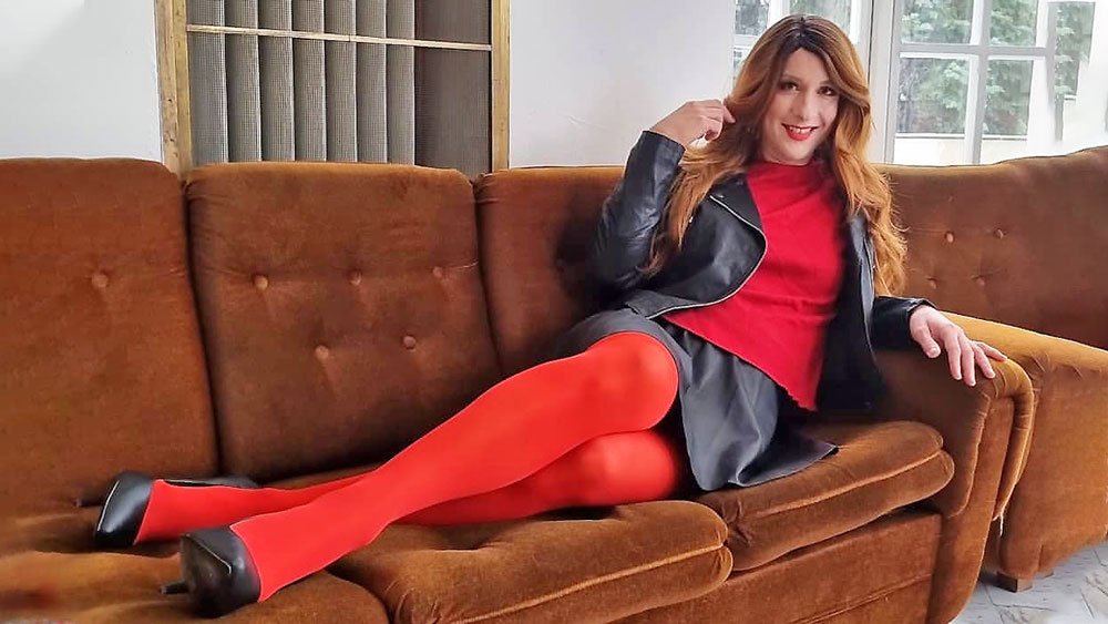 crossdresser in skirt and red stockings