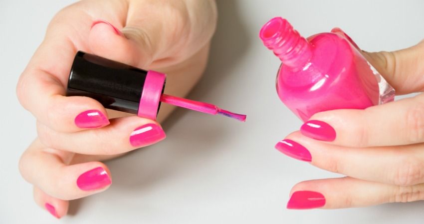 crossdressing - putting on nail polish