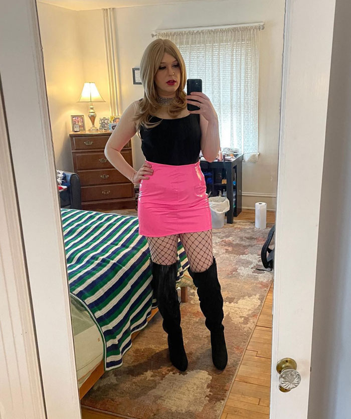 cute crossdresser in pink miniskirt