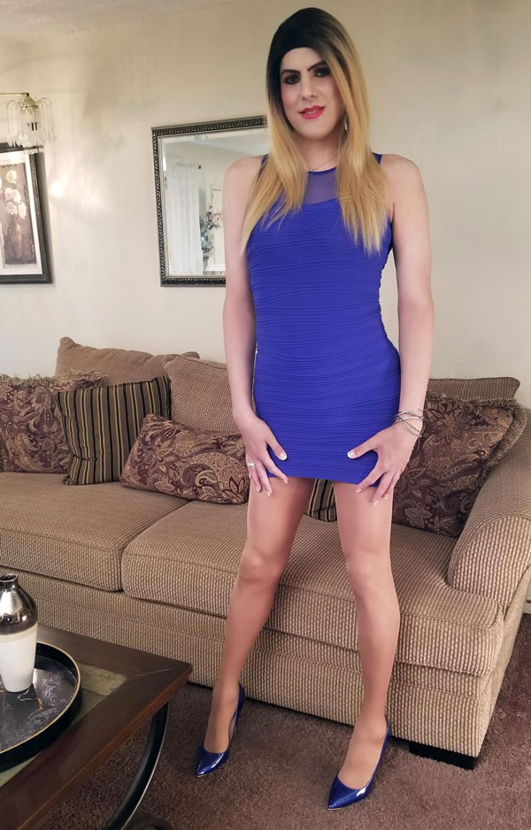 Crossdresser Emily in mini blue dress and high heels