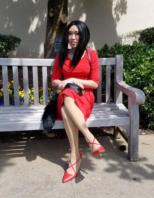 Crossdresser Layla in red dress and heels