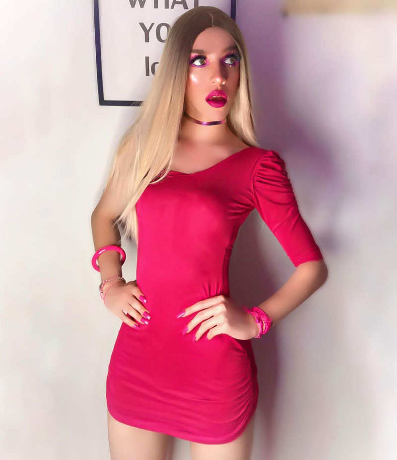 crossdresser in pink mini dress