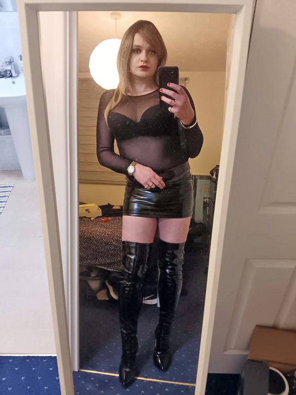 crossdresser in mini skirt and boots